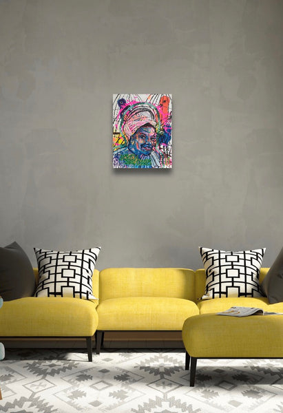 This portrait features legendary poet, Maya Angelou and is titled ‘SPIRITED’. This painting is acrylic on a 16x20” stretched canvas.  Artwork is shown hanging on a wall.
