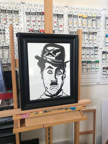 'CHARLIE CHAPLIN' original framed painting. This painting is acrlic on Bristol. This original piece of art is 11x14, but is 14.75x17.75" including the dimensions of the frame.  Artwork shown on my easel in my art studio.